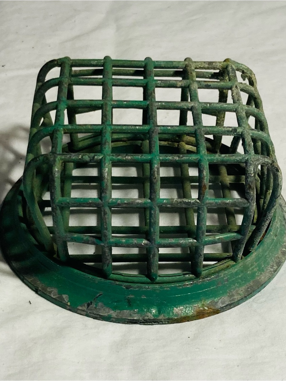 Antique floral frog iron grid over round base for holding cut flowers in vase